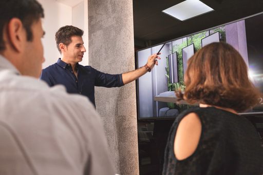 A closeup of young architects discussing together inside a conference room