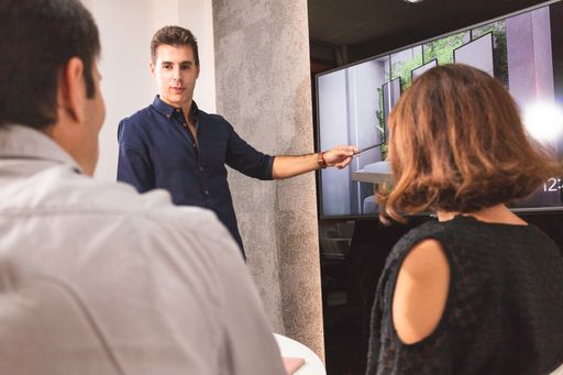 A closeup of young architects discussing together inside a conference room