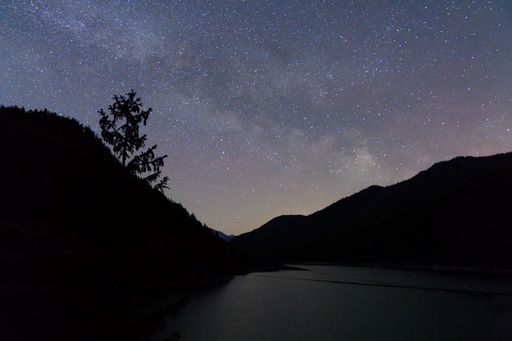 A beautiful shot of the starry sky and constellations over the mountains at night