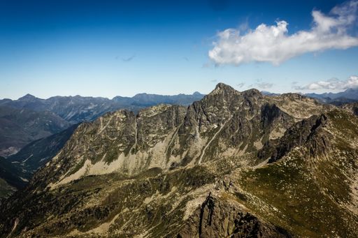 An aerial view of the beautiful mountains at the Aiguestortes National Park under a cloudy sky