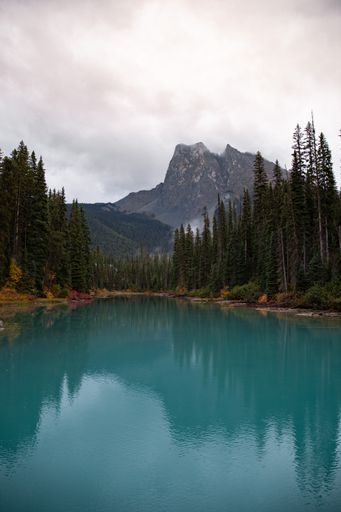 A vertical shot of the Emerald Lake surrounded by hills in Yoho National Park in Canada