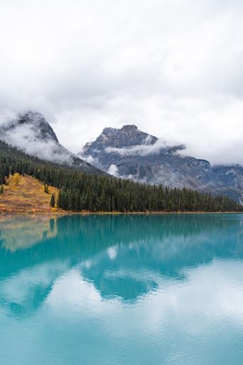 A vertical shot of the Emerald Lake surrounded by hills in Yoho National Park in Canada