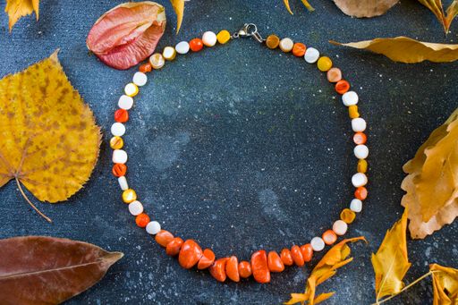 A top view of a colorful necklace with beads