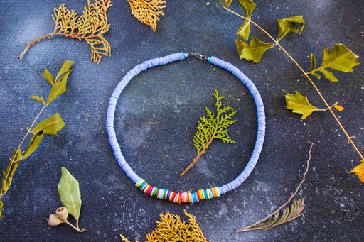 A top view of a colorful necklace with beads
