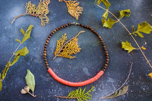 A top view of a colorful necklace with beads