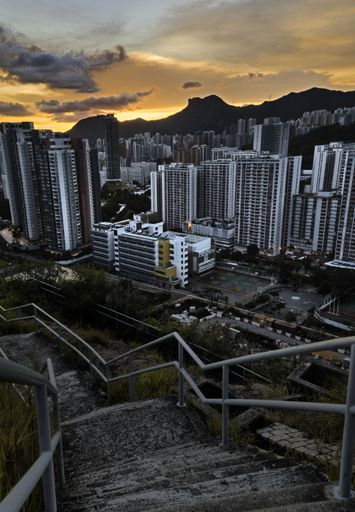 The sunset sky over the cityscape with modern skyscrapers captured in the evening