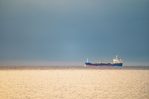 A huge ship sailing in the English Channel, France against the clear blue sky on a sunny day