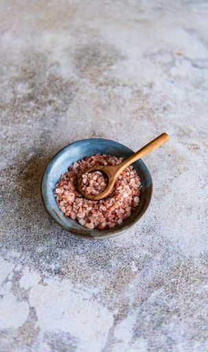 Coarse Pink Himalayan Salt in handmade ceramic bowl with wooden spoon