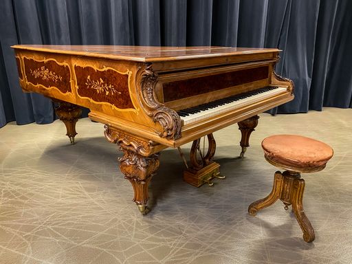 A closeup of a vintage piano