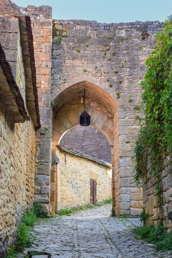 A closeup of a stone arch in the medieval village of Beynac et Cazenac, France