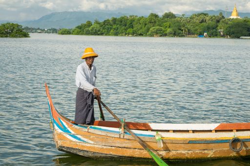 Burmese fishermen in small fishing boats near U-Bein Bridge, in Taungthaman Lake near Amarapura, close to city of Mandalay in Myanmar, Burma, SE Asia