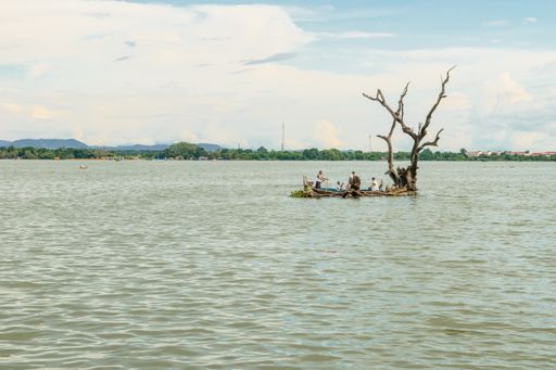 Burmese fishermen in small fishing boats near U-Bein Bridge, in Taungthaman Lake near Amarapura, close to city of Mandalay in Myanmar, Burma, SE Asia