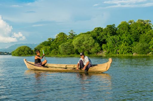 Burmese fishermen in small fishing boats near U-Bein Bridge, in Taungthaman Lake near Amarapura, close to city of Mandalay in Myanmar, Burma, SE Asia