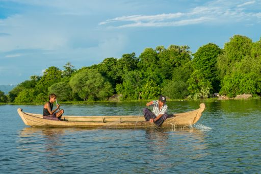 Burmese fishermen in small fishing boats near U-Bein Bridge, in Taungthaman Lake near Amarapura, close to city of Mandalay in Myanmar, Burma, SE Asia