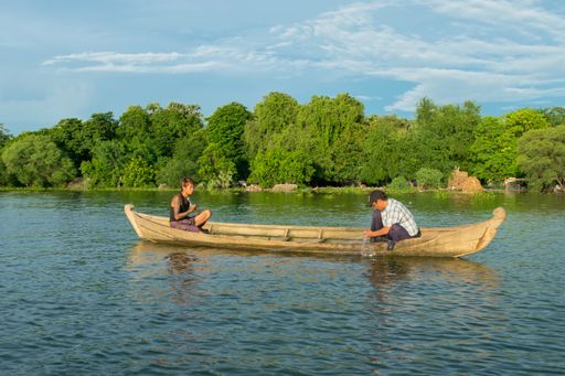 Burmese fishermen in small fishing boats near U-Bein Bridge, in Taungthaman Lake near Amarapura, close to city of Mandalay in Myanmar, Burma, SE Asia