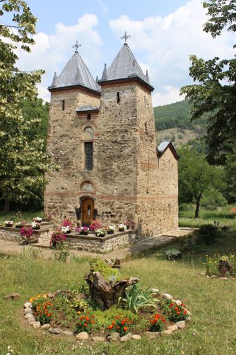 A vertical shot of an ancient church in the beautiful forest