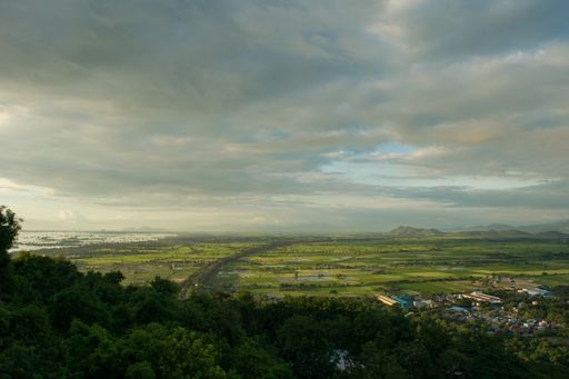 The view from on top of Mandalay Hill, at sunset during the monsoon season. Beautiful day and cloudy sky, over the city of Mandalay, Myanmar, Burma