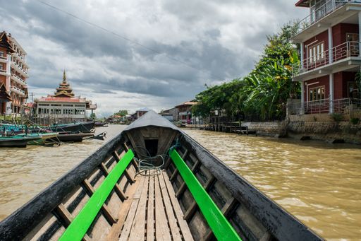 First person view while travelling on a Burmese long boat in Inle Lake, Shan Region, Myanmar, during monsoon season on a cloudy day, Burma, SE Asia