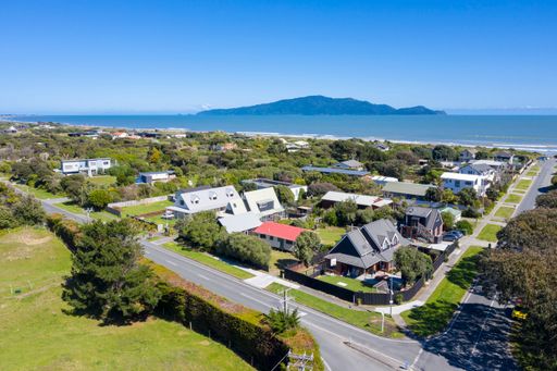 aerial shot Peka Peka village  also showing kapiti Island on a blue sky day. In Kapiti region of New zealand near Wellington
