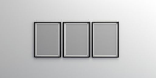 An empty wall with blank picture frames