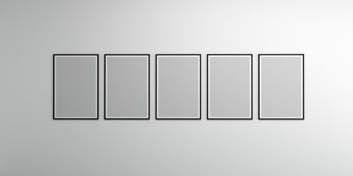 An empty wall with blank picture frames