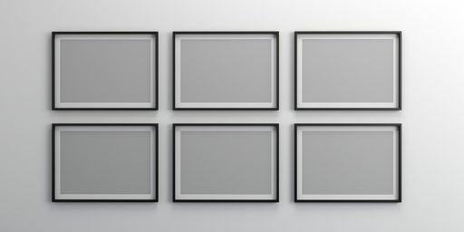 An empty wall with blank picture frames