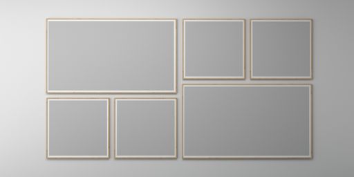 An empty wall with blank picture frames