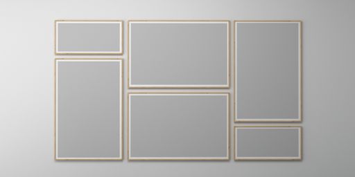 An empty wall with blank picture frames