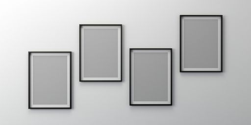 An empty wall with blank picture frames