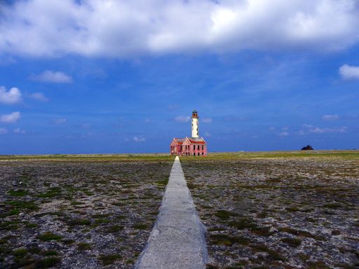 A scenic shot of an abandoned lighthouse on Klein Curacao island
