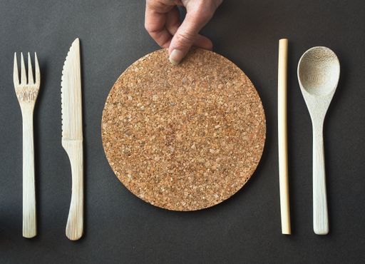 A top view of eco-friendly bamboo and cork cutlery