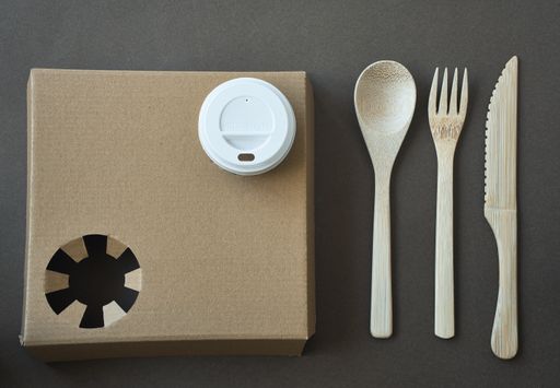 A top view of an eco friendly cup holder and cutlery