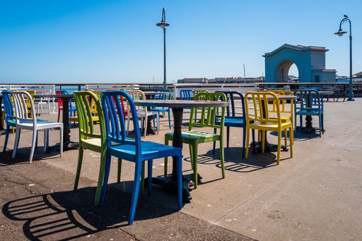 The colorful chairs with tables in the outdoors cafe in San Francisco, California
