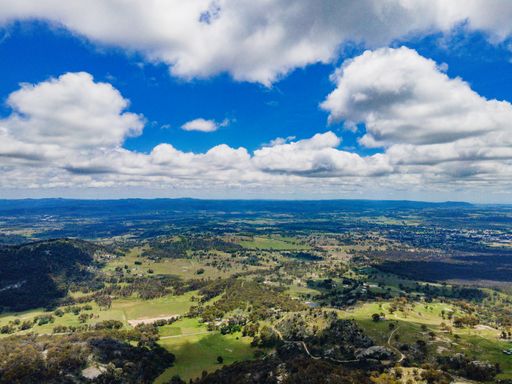 An aerial shot of Mount Mackenzie Lookout out near Tenterfield, NSW, 2372 in Australia on a sunny day