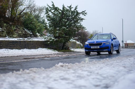 A view of a driver face the icy road on a gloomy winter day in Leeds, United Kingdom