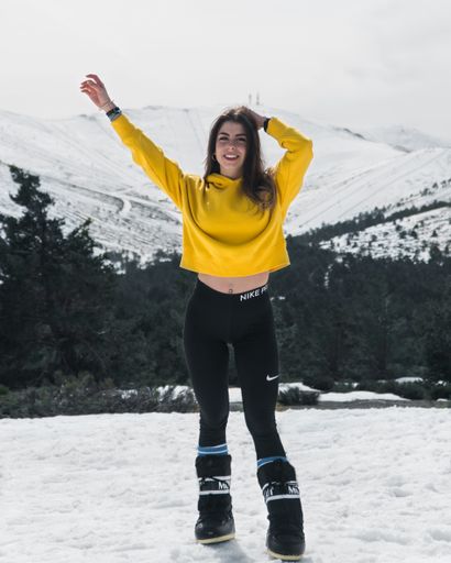A portrait of a lovely girl on a snowy mountain