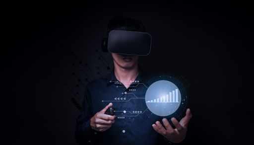 A young Asian man wearing virtual reality glasses and holding a 3D rendered business graph in hand
