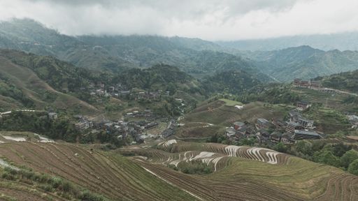 A beautiful aerial shot of a Chinese town surrounded by amazing nature