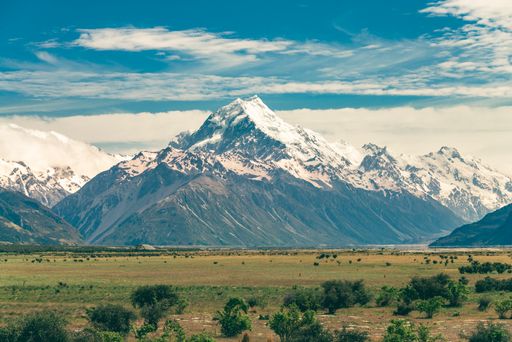 The cloudy sky over Mt Cook, Canterbury, New Zealand, South Island captured from a green valley