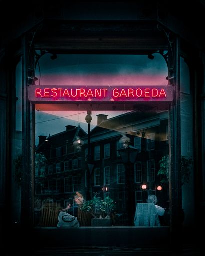 A closeup of restaurant garoeda neon pink sign