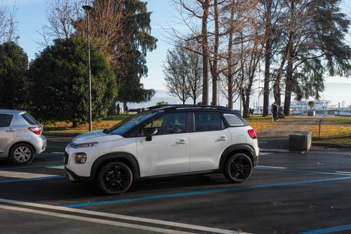 A parked Citroen Suv Cross in the daytime.