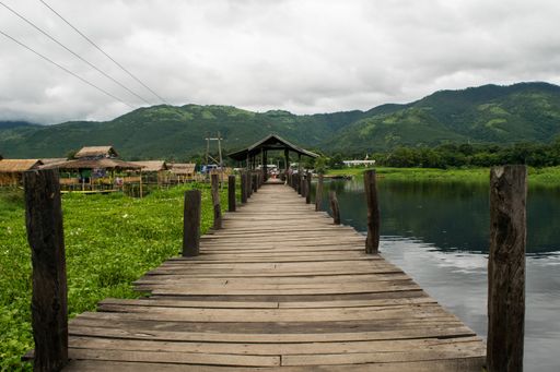 A wooden bridge used to walk along the towns of Inle Lake, Shan region, Myanmar, Burma, during monsoon season when water level rises. Asia