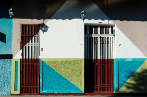 The doors and painted wall in the city of Granada, Nicaragua captured on a sunny day in summer