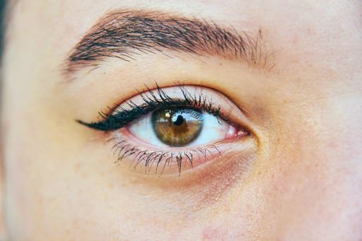 brown color of a girl's human eye close up