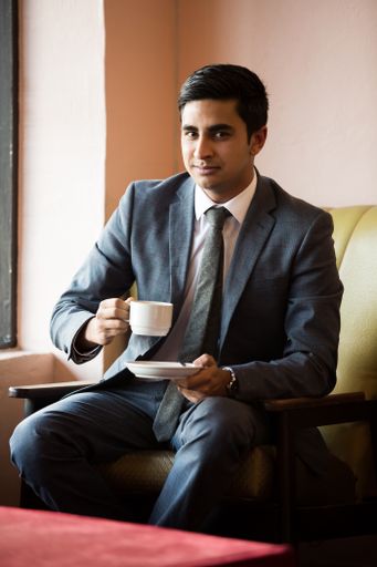 A shot of Rush Bhana, Entrepreneur and businessman sitting on a chair and drinking coffee