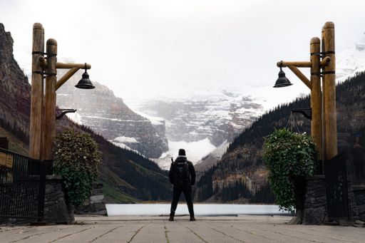 A closeup of a person standing near the lake
