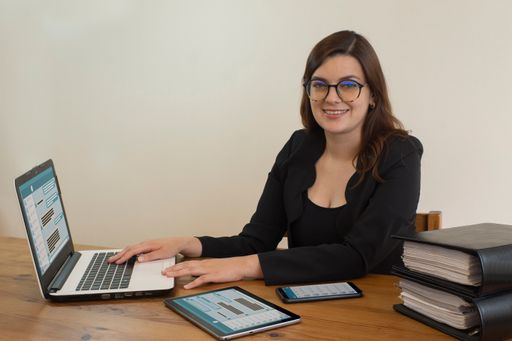 A Hispanic young businesswoman working in her office
