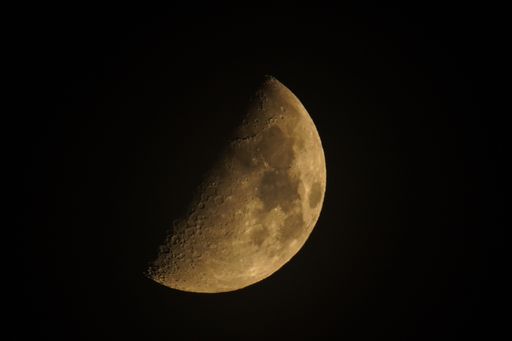 A closeup shot of the moon in the dark night sky