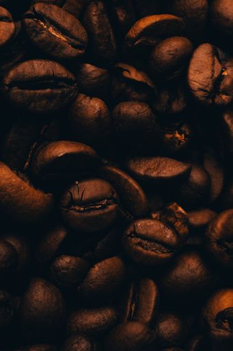 A vertical shot of a bunch of coffee beans