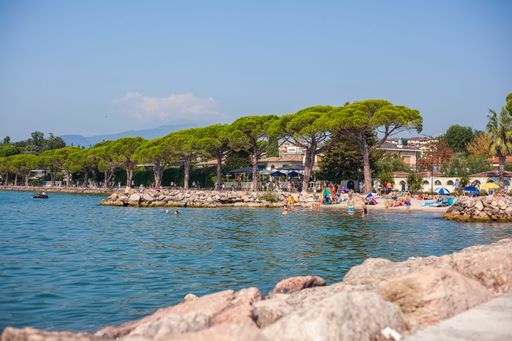 Lazise Beach in Garda Lake in Italy during sunset time